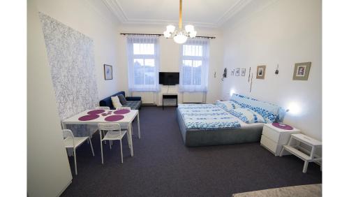 a living room with a couch and a table at Apartments Katarina in Prague