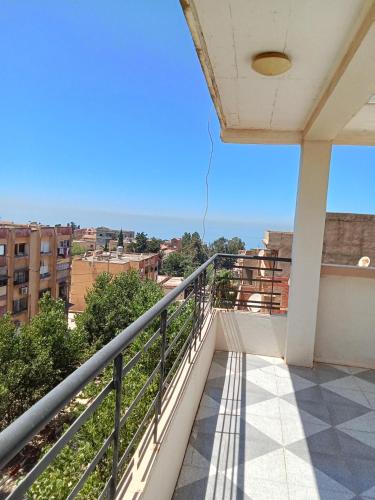 a balcony with a view of the city at Cléopâtre la chrétienne in Tefeschoun