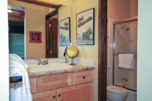 a bathroom with a sink and a mirror at Discovery 4 142 Loft in Mammoth Lakes
