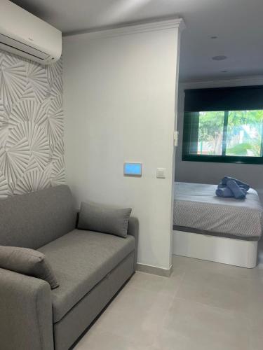 a living room with a couch and a bed at Alondras Luxury Paradise fully renovated in Arona