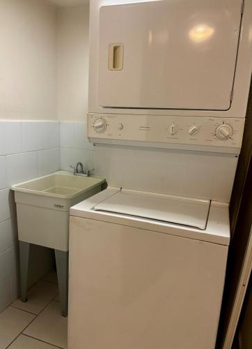 a small white bathroom with a sink and a mirror at Apartamento en Ecovivienda Tegucigalpa in Tegucigalpa