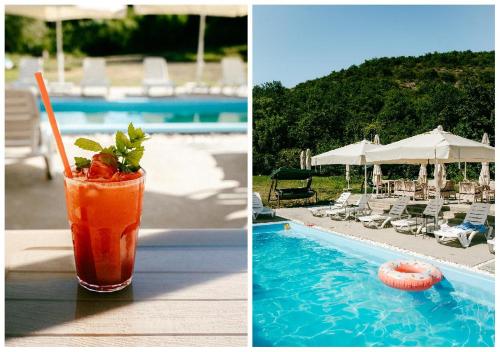 a drink sitting on a table next to a swimming pool at Gipsy Village Park Hotel in Asuretʼi