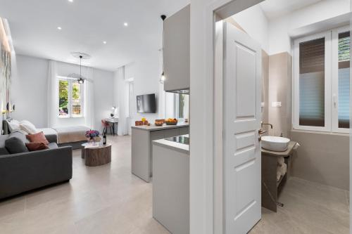 a kitchen and living room with a white door at Rebirth apartments in Dubrovnik