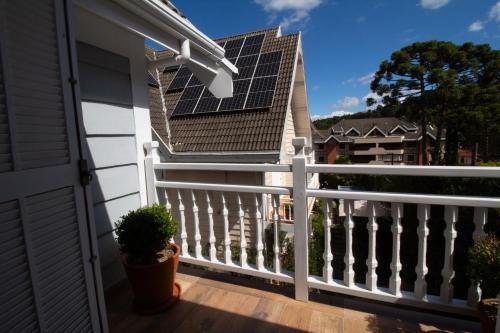 a house with solar panels on the roof at Secreto Boutique Hotel in Campos do Jordão