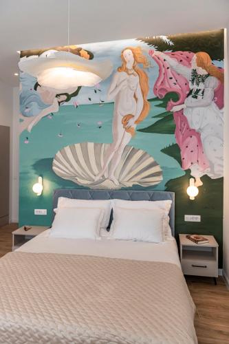 a bedroom with a mural of a mermaid on the wall at Rebirth apartments in Dubrovnik