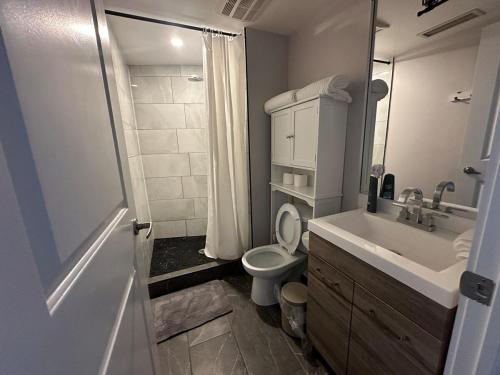 A bathroom at Stylish 2BR Suite by Square One