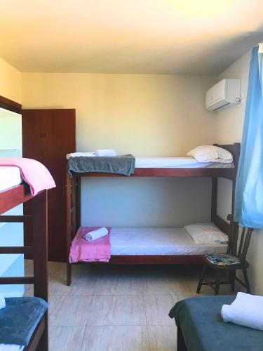 Ein Bett oder Betten in einem Zimmer der Unterkunft Pousada Nova Trilha