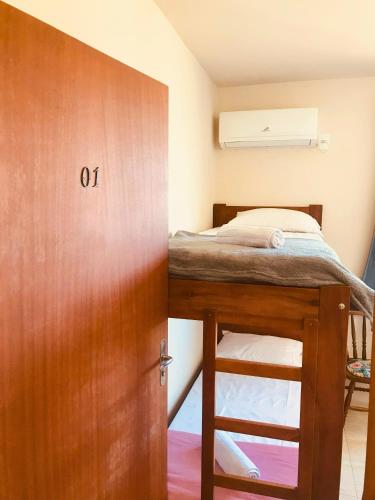 Ein Bett oder Betten in einem Zimmer der Unterkunft Pousada Nova Trilha