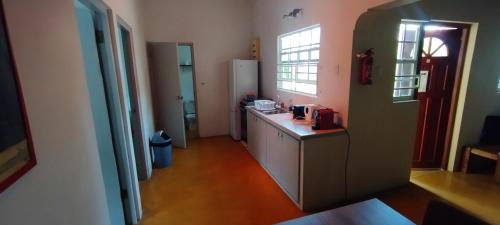 a kitchen with a counter top in a room at The Dive Hut - Boutique Apartments in Kralendijk