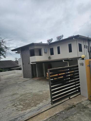 a house with a gate in front of it at PK Homestay in Suva