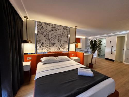 a bedroom with a large bed in a room at OTTO Tunalı Houses in Ankara