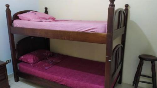 a couple of bunk beds in a room at TUCACAS Punta Brava in Tucacas
