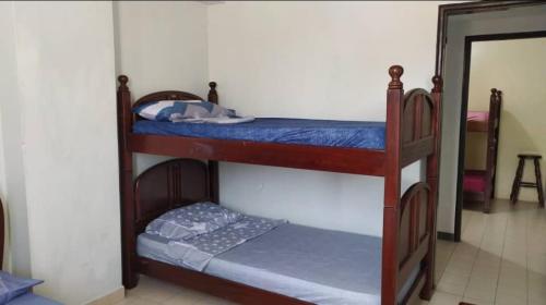 a couple of bunk beds in a room at TUCACAS Punta Brava in Tucacas
