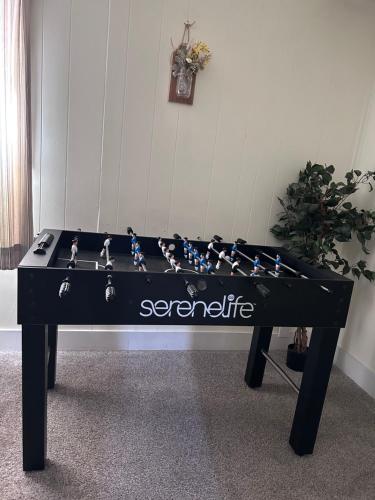 a ping pong table with a chess board on it at Sunny Days in Pocatello