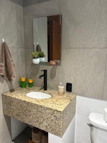 a bathroom with a sink and a mirror at Casa Guaria Morada in Valle de Bravo