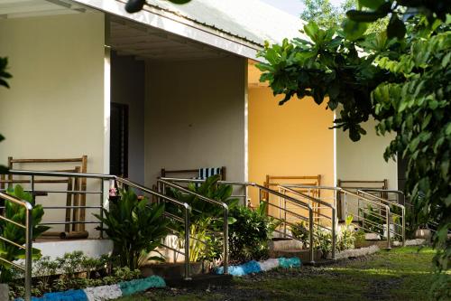 a building with stairs and plants in front of it at Ana-as Apartelle (GGL) in Panglao