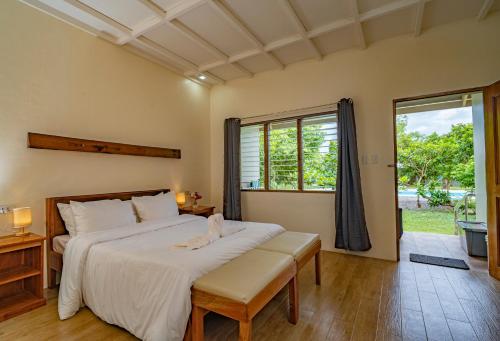 Postel nebo postele na pokoji v ubytování Ana-as Apartelle (GGL)