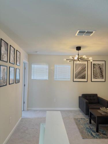 a living room with a couch and a table at Abi home in Brandon