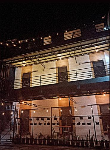 a building with a balcony on the side of it at Kua's Pad Tagaytay in Tagaytay