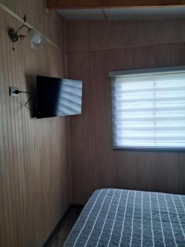 Postel nebo postele na pokoji v ubytování Cabañas Puente Viejo