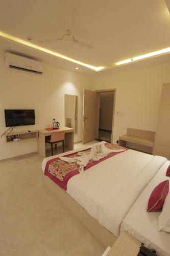 Ένα ή περισσότερα κρεβάτια σε δωμάτιο στο Hotel Grand Vasaante