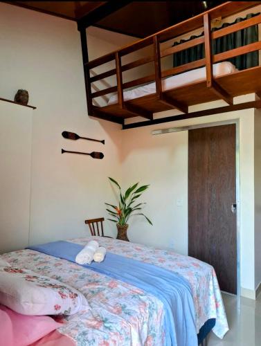 a bedroom with a bed with a loft bed at Casa Carauarí in Alter do Chao