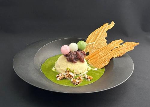 a dessert on a plate on a table at hotel tou nishinotoin kyoto in Kyoto