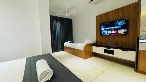 Ένα ή περισσότερα κρεβάτια σε δωμάτιο στο Vaigai Residency