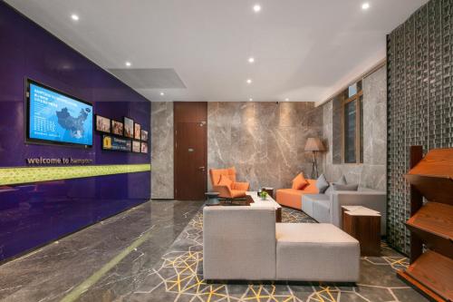 Televisyen dan/atau pusat hiburan di Hampton by Hilton Foshan Dali
