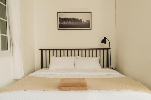 Postel nebo postele na pokoji v ubytování Dusk House