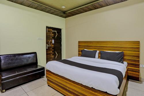 Ένα ή περισσότερα κρεβάτια σε δωμάτιο στο Hotel O Yatika Inn