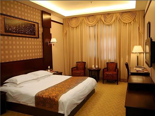 Postel nebo postele na pokoji v ubytování Dengfeng Chanwu Hotel