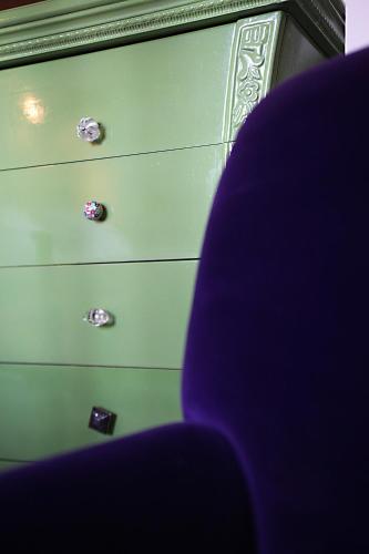 a green dresser with a blue chair next to it at L'Alcazar in Rabat