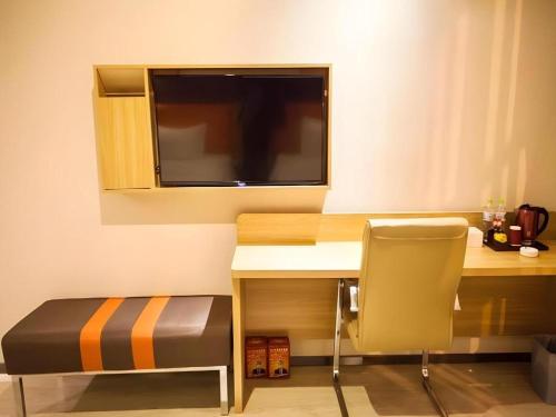 Un lugar para sentarse en 7 Days Premium Tongliao Train Station Branch