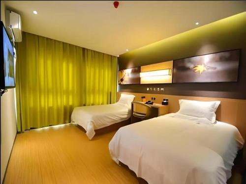 Katil atau katil-katil dalam bilik di IU Hotel Zhengzhou Xinzheng Sias International University Branch
