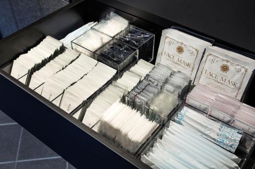 a drawer filled with different types of brushes at hotel tou nishinotoin kyoto in Kyoto