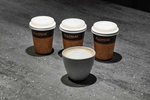 four cups of coffee sitting on the ground at hotel tou nishinotoin kyoto in Kyoto