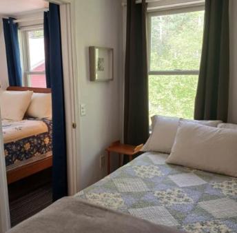 a bedroom with a bed and a window at Charming Guest House! in Exeter