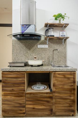 a kitchen with a sink and a counter top at Homestay Nhacuabu in Hanoi