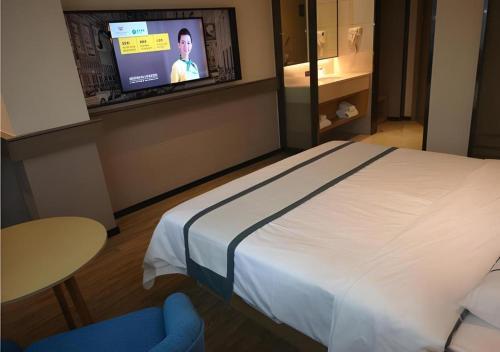 Ένα ή περισσότερα κρεβάτια σε δωμάτιο στο City Comfort Inn Mianyang Southwest University Of Science And Technology