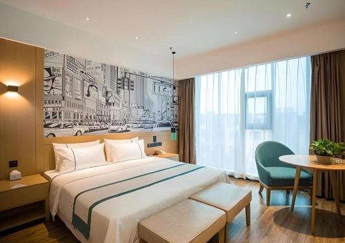 Postel nebo postele na pokoji v ubytování City Comfort Inn Suzhou Zhangjiagang Jingang Changjiang Xi Road