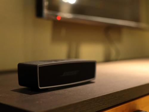 a black toaster sitting on a counter in front of a microwave at 京一軒町家 さと居 鉄仙 SATOI TESSEN Omiya-Gojo in Kyoto