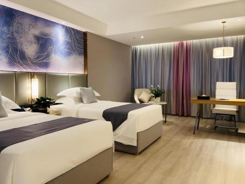 Кровать или кровати в номере Green Tree Inn Tianjin Dongli District Airport Free Trade Zone