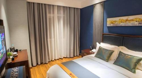 Postel nebo postele na pokoji v ubytování Shell Hotel Tai'an Feicheng Longshan Road