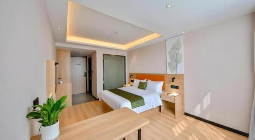Ένα ή περισσότερα κρεβάτια σε δωμάτιο στο Green Tree Inn Express Zhejiang Zhoushan Xincheng Zheda