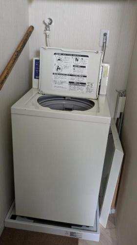 a washer and dryer sitting in a room at Tokyo Skytree Tower - Asakusa Auberge de Jeunesse in Tokyo