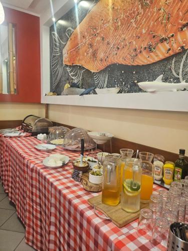 a table with a red and white checkered table cloth at "Hel" Wieniec Zdrój in Włocławek