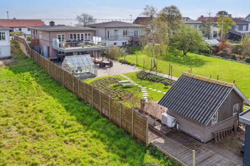 an aerial view of a house with a fence at Sea And Meadow Views Space And Calm in Nyborg
