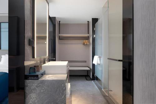 Ένα ή περισσότερα κρεβάτια σε δωμάτιο στο Echarm Hotel Zhuzhou Liling