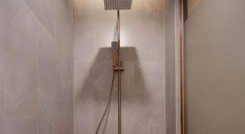 a floor lamp in a corner of a room at ZMAX Hotels Shenzhen Lianhuacun Metro Station in Shenzhen